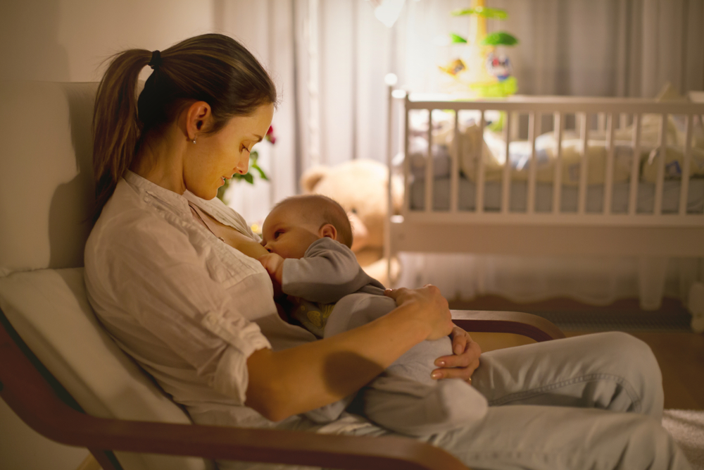 Young mother breastfeeding her baby