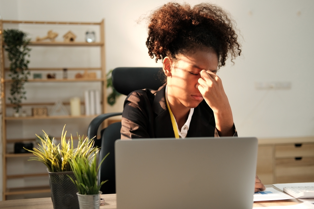 Stressed out woman sitting at her computer