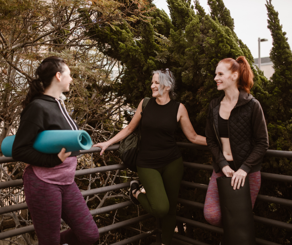 Three women in workout gear celebrating the change of PCOS to PMOS